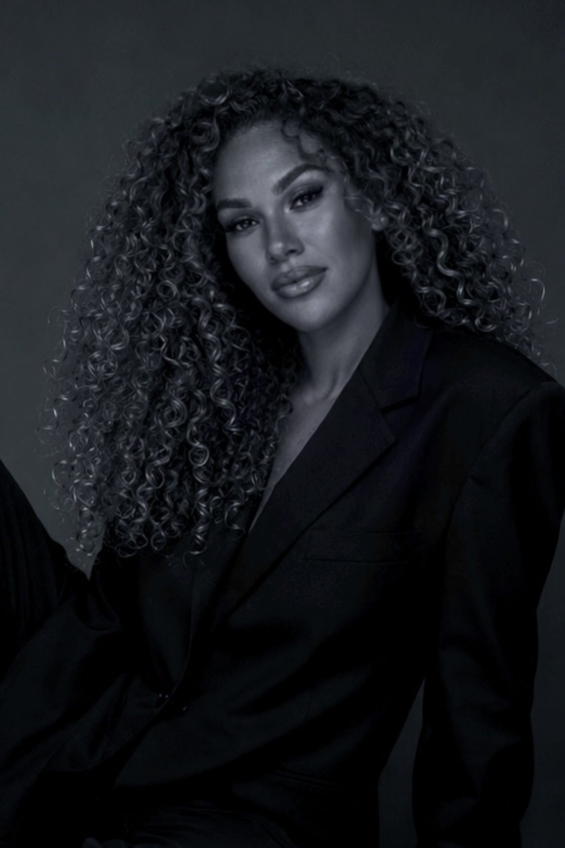 Malak Ezzakraoui, founder of Kelya, in a black suit.